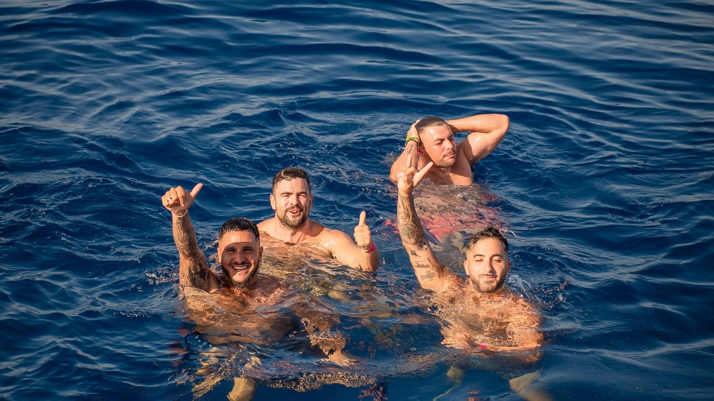 Stag group enjoying a swim stop in the sea during a Marbella private boat charter